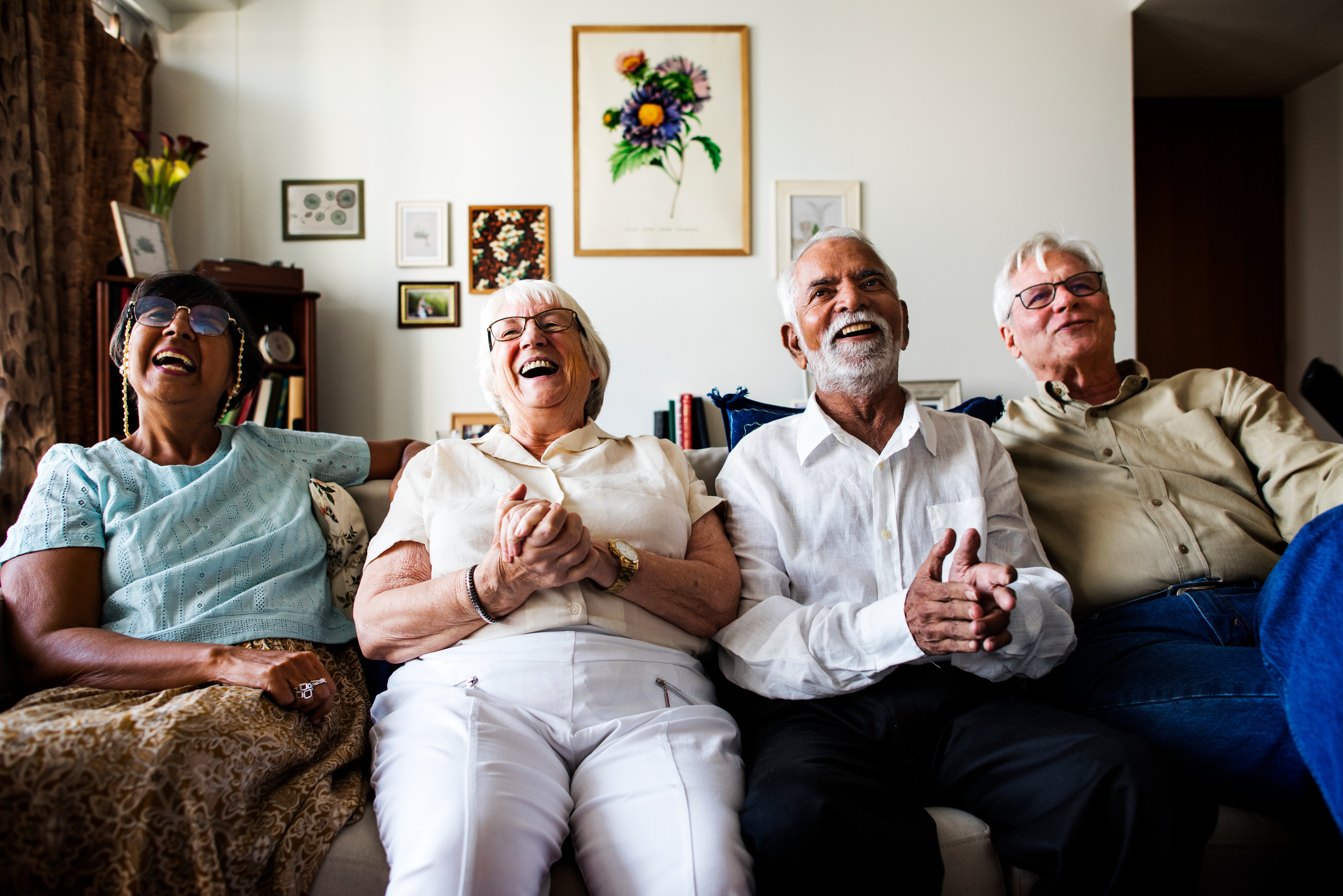 group-senior-friends-sitting-watching-tv-together